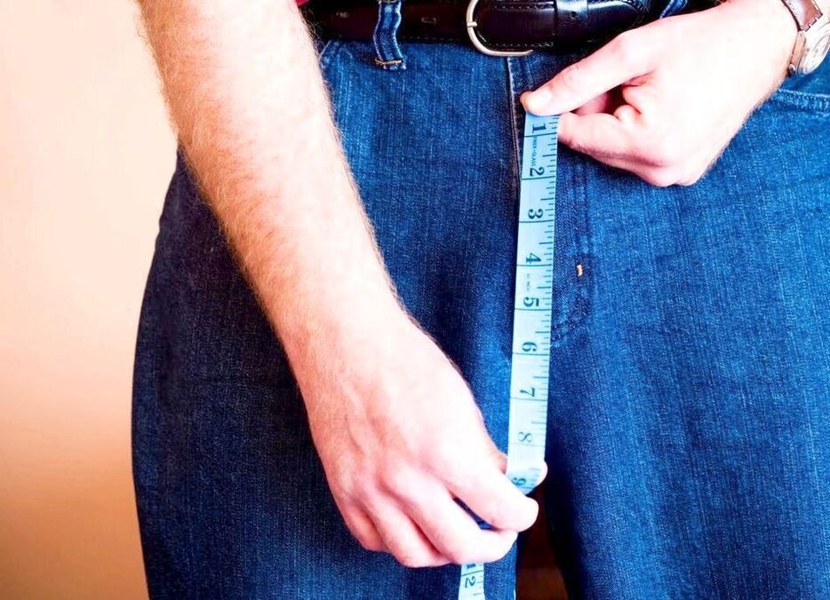 Man measuring penis after enlargement